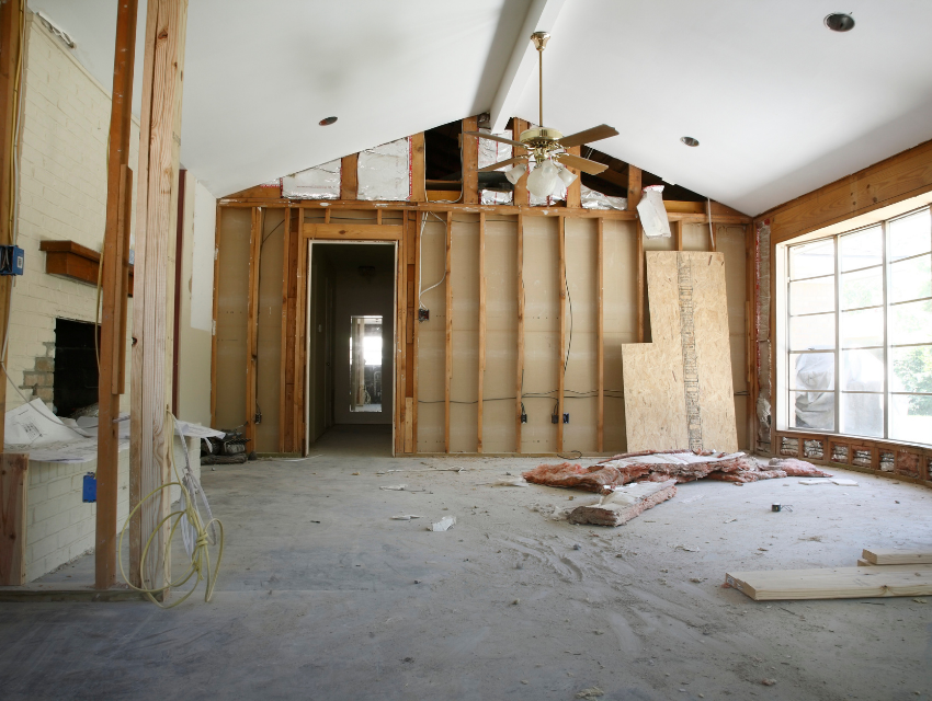 Illustrative demo-phase photo of a similar house, not 6 N Brighton Ave: walls opened to the studs and insulation