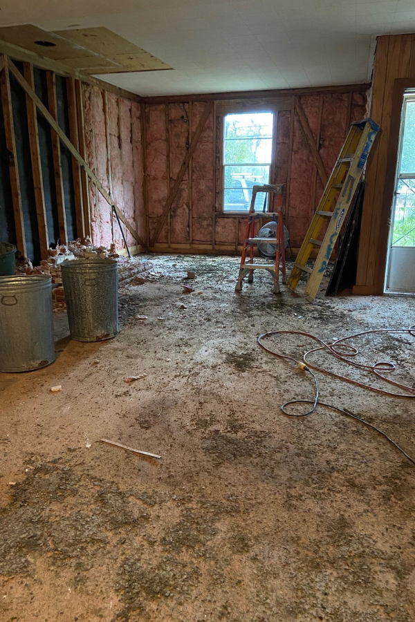 Illustrative demo-phase photo of a similar house, not 6 N Brighton Ave: gutted room with exposed framing and debris